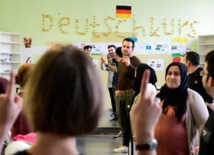 Syrians in Germany face fight fit for Kafka to see families