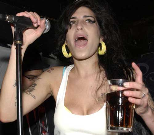 Amy Winehouse's husband seeks divorce, citing adultery: lawyer