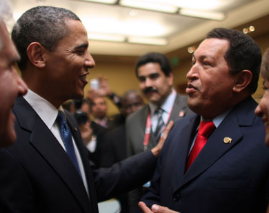 After handshake, Chavez offers Obama a book