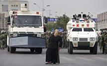 China raises Xinjiang death toll to 184 China raises Xinjiang death toll to 184