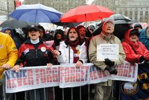 People sing during a rally by the 9/11 Never Forget Coalition