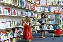 Two children at a book fair (AFP/File/Ramzi Haidar) Two children at a book fair (AFP/File/Ramzi Haidar)