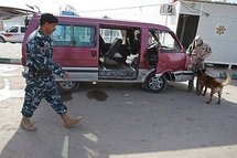 Iraqi security forces inspecting a van entering Karbala on 22nd December 2009 (AFP/File/Mohammed Sawaf) Iraqi security forces inspecting a van entering Karbala on 22nd December 2009 (AFP/File/Mohammed Sawaf)