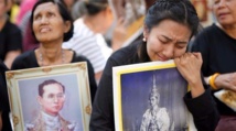 Thai man detained for planning to wear red on late king's funeral day