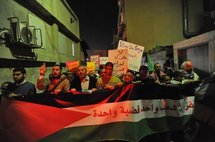 Arab-Israelis protesting in Jaffa to mark the one-year-anniversary of the Israeli war on Gaza