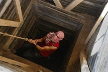 A Palestinian smuggler climbing a tunnel which links the southern Gaza strip town of Rafah with Egypt in 2009  (AFP/File/Said Khatib)