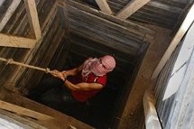 A Palestinian smuggler climbing a tunnel which links the southern Gaza strip town of Rafah with Egypt in 2009 (AFP/File/Said Khatib) A Palestinian smuggler climbing a tunnel which links the southern Gaza strip town of Rafah with Egypt in 2009 (AFP/File/Said Khatib)