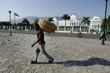 A Haitian man walking past the Presidential Palace, in 2006 A Haitian man walking past the Presidential Palace, in 2006
