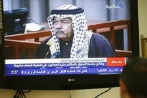 A journalist watching the Al-Iraqiya channel as it airs the taped trial and sentencing of Ali Hassan al-Majid ('Chemical Ali') (AFP/Sabah Arar) A journalist watching the Al-Iraqiya channel as it airs the taped trial and sentencing of Ali Hassan al-Majid ('Chemical Ali') (AFP/Sabah Arar)