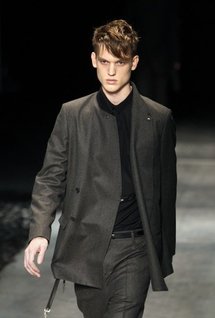 A model presents a creation by designer Kris Van Assche for Dior A model presents a creation by designer Kris Van Assche for Dior
