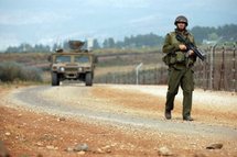 An Israeli soldier patrols the border with Lebanon An Israeli soldier patrols the border with Lebanon