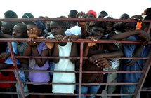 Haitians wait to receive food and supplies from UN peacekeepers in Port-au-Prince