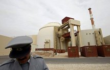 An Iranian security guard outside the reactor building at the Bushehr nuclear power plant