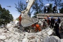 A UN image of Brazilian and Chinese rescue teams searching the rubble of the UN headquarters in Port-au-Prince (AFP/File/Logan Abassi)