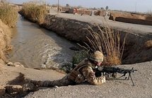 A British soldier takes his position during a patrol in Qari Saheb village in the Helmand province on the third day of a joint operation Mushtarak. (AFP/Massoud Hossaini) A British soldier takes his position during a patrol in Qari Saheb village in the Helmand province on the third day of a joint operation Mushtarak. (AFP/Massoud Hossaini)