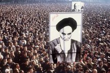 Demonstrators holding a poster of Ayatollah Ruhollah Khomeini in January 1979, in Tehran Demonstrators holding a poster of Ayatollah Ruhollah Khomeini in January 1979, in Tehran
