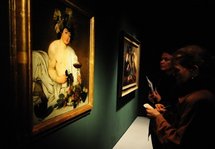 Visitors view paintings by Caravaggio Visitors view paintings by Caravaggio