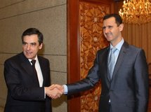 French Prime Minister Francois Fillon (left) is greeted by Syrian President Bashar al-Assad
