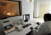 A hospital employee performs a magnetic resonance scan on a patient in 2009 A hospital employee performs a magnetic resonance scan on a patient in 2009