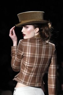 A model presents a creation by John Galliano A model presents a creation by John Galliano