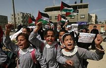 Palestinian women and girls demonstrate in the southern Gaza Strip refugee camp of Rafah (AFP/Said Khatib)