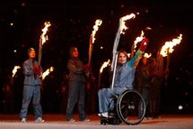 Torch bearer Marni Abbott-Peter waves during the opening ceremony of the Paralympics in Vancouver Torch bearer Marni Abbott-Peter waves during the opening ceremony of the Paralympics in Vancouver