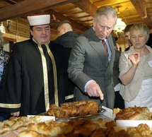 Princes Charles (centre), owner of Tatar restaurant Dzenneta Bogdanowicz (right) and Mufti Tomasz Miskiewicz (left)