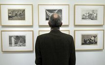 A visitor looks at engravings by Goya A visitor looks at engravings by Goya