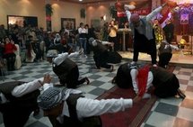 Syrian Kurds celebrate the Noruz spring festival with a traditional dance in a restaurant in Damascus. (AFP/File/Louai Beshara)