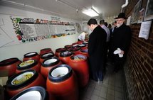 People queue to order home-made pickles at The Pickle Guys People queue to order home-made pickles at The Pickle Guys