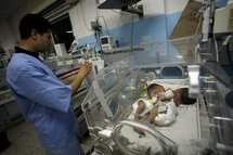 Medical personnel attend to Ritaj (left) and Rittal (right). Medical personnel attend to Ritaj (left) and Rittal (right).