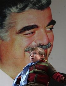 A Lebanese boy visits the grave of former Lebanese premier Rafiq Hariri (pictured).