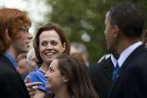Sigourney Weaver (centre) stands with President Barack Obama (left) as he talks with members of the audience. Sigourney Weaver (centre) stands with President Barack Obama (left) as he talks with members of the audience.