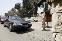 Iraqi soldiers stop vehicles at a checkpoint in Baghdad, in April 2010. Iraqi soldiers stop vehicles at a checkpoint in Baghdad, in April 2010.