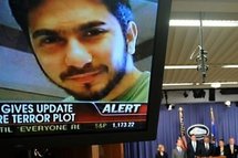 An image of Faisal Shahzad is seen on a TV screen as US Attorney General Eric Holder, Secretary of the Department of Homeland Security Janet Napolitano, Deputy Director of the FBI John S. Pistole and New York Police Commissioner Raymond Kelly hold a brief An image of Faisal Shahzad is seen on a TV screen as US Attorney General Eric Holder, Secretary of the Department of Homeland Security Janet Napolitano, Deputy Director of the FBI John S. Pistole and New York Police Commissioner Raymond Kelly hold a brief