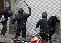 Iranian security forces on motorcycles surround opposition protesters during clashes in Tehran. Iranian security forces on motorcycles surround opposition protesters during clashes in Tehran.