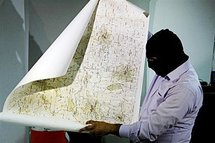 A Lebanese security officer holds a map found with arrested Lebanese nationals accused of spying for Israel in 2009. A Lebanese security officer holds a map found with arrested Lebanese nationals accused of spying for Israel in 2009.