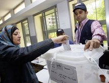 A Lebanese woman casts her vote in Beirut. A Lebanese woman casts her vote in Beirut.