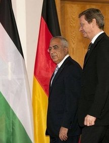 German Foreign Minister Guido Westerwelle (right) and Palestinian Prime Minister Salam Fayyad arrive at the Foreign Ministry in Berlin.