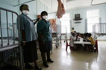 Nurses stand in a TB pediatric ward in South Africa. Nurses stand in a TB pediatric ward in South Africa.
