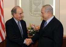 A handout picture released by the US embassy in Israel shows Israel Prime Minister Benjamin Netanyahu (right) shaking hands with US envoy George Mitchell during a meeting in Jerusalem.