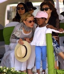 Madonna speaks to her adopted daughter Mercy James during the brick laying ceremony at the 'Raising Malawi Academy for Girls' in Chinkhota, in April 2010. Madonna speaks to her adopted daughter Mercy James during the brick laying ceremony at the 'Raising Malawi Academy for Girls' in Chinkhota, in April 2010.