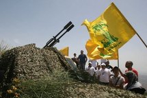Lebanese tourists look at a Hezbollah anti-aircraft gun. Lebanese tourists look at a Hezbollah anti-aircraft gun.