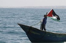 A Palestinian boy flashes the V-sign for victory as hundreds of Palestinians waited on fishing boats at the port of Gaza City to greet the 'Freedom Flotilla'.