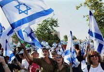 Israeli youths from rural communities wave national flags during a march in Jerusalem in salute to the city and the Israeli army, following Israel's raid on the aid flotilla bound for the Gaza Strip that left nine people dead.