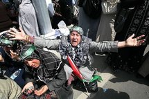 Turkish women cry as they pray for Palestinians during a protest against Israel in Ankara.