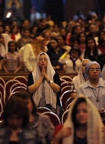 Egyptian Christians pray during the Easter Coptic Christian mass at Cairo's Abbassiya Cathedral in April 2010.