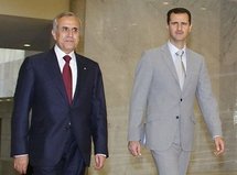 Lebanese President Michel Sleiman (left) meets with Syrian President Bashar al-Assad at al-Shaab palace in Damascus.