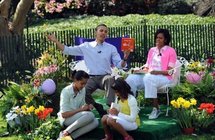 US President Barack Obama (left) with US First Lady Michelle Obama (right), and daughters Malia (seated left) and Sasha