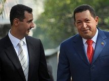 Syrian President Bashar al-Assad (left) talks with Venezuelan President Hugo Chavez after meeting at the Miraflores presidential palace in Caracas.